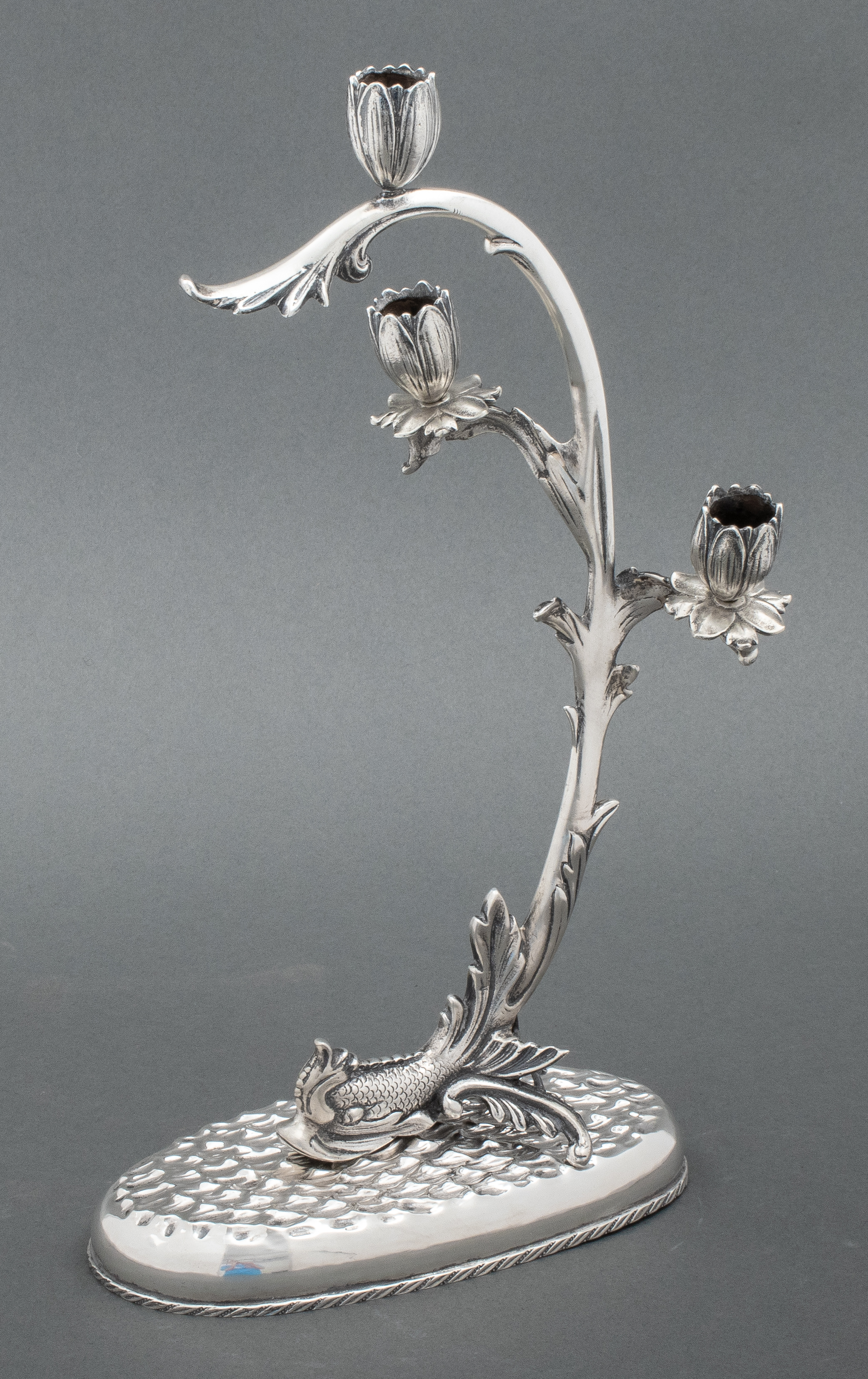 Appraisal: EUROPEAN SILVER DOLPHIN-FORM CANDELABRA European silver three-light candelabrum one with