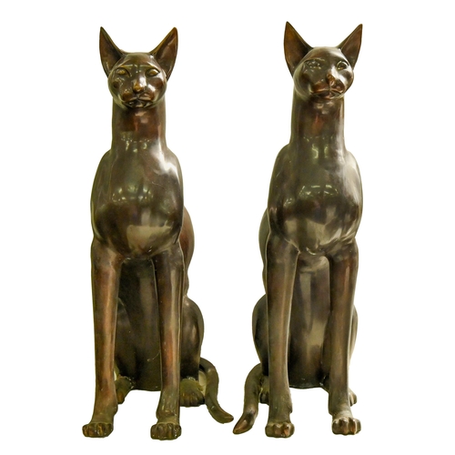 Appraisal: A pair of bronze patinated brass sculptures of seated cats