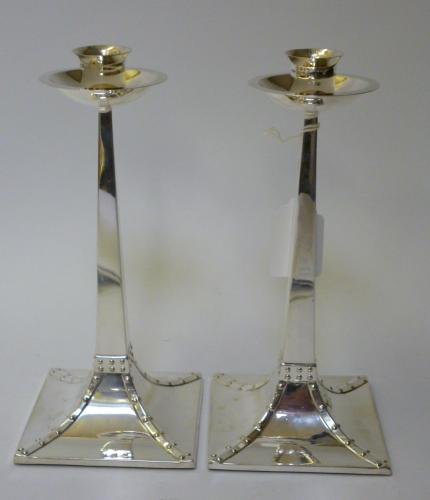 Appraisal: A PAIR OF ARTS AND CRAFTS CANDLESTICKS maker Dixons Sheffield