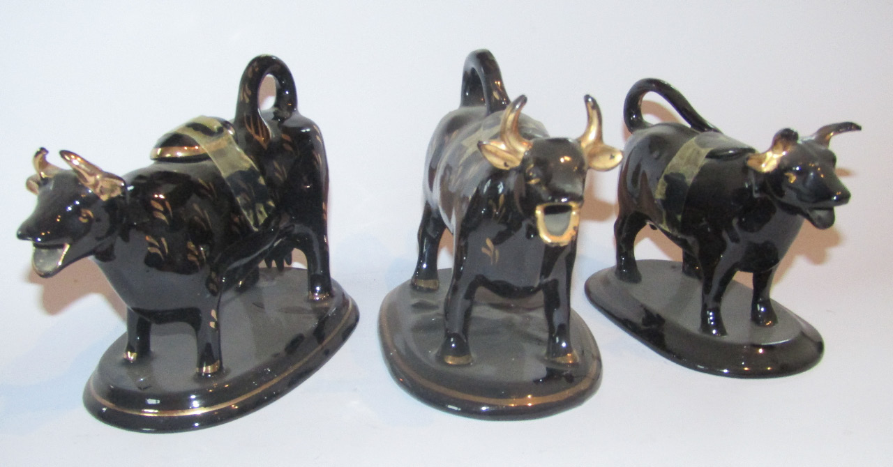 Appraisal: A late thC Jackfield style pottery cow creamer with tail