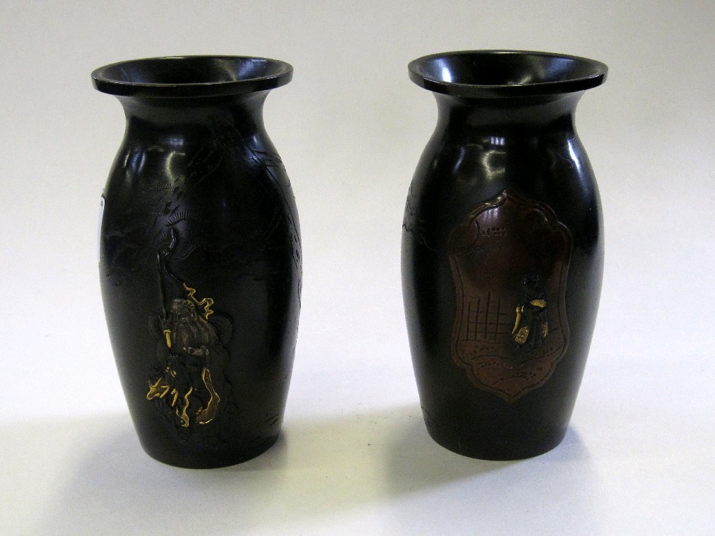 Appraisal: Pair of small oriental bronze vases decorated with a sage