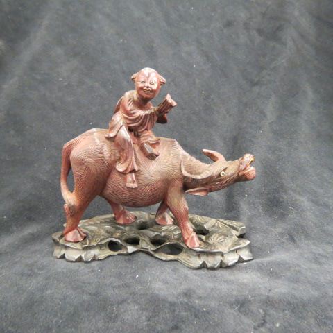 Appraisal: Chinese Carved Wooden Figurine of Childriding a water buffalo withe