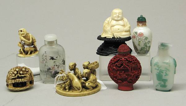 Appraisal: A group of Asian snuff bottles and small ivory carvings