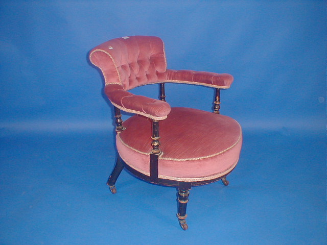 Appraisal: A Victorian ebonised tub chair with pink draylon upholstery