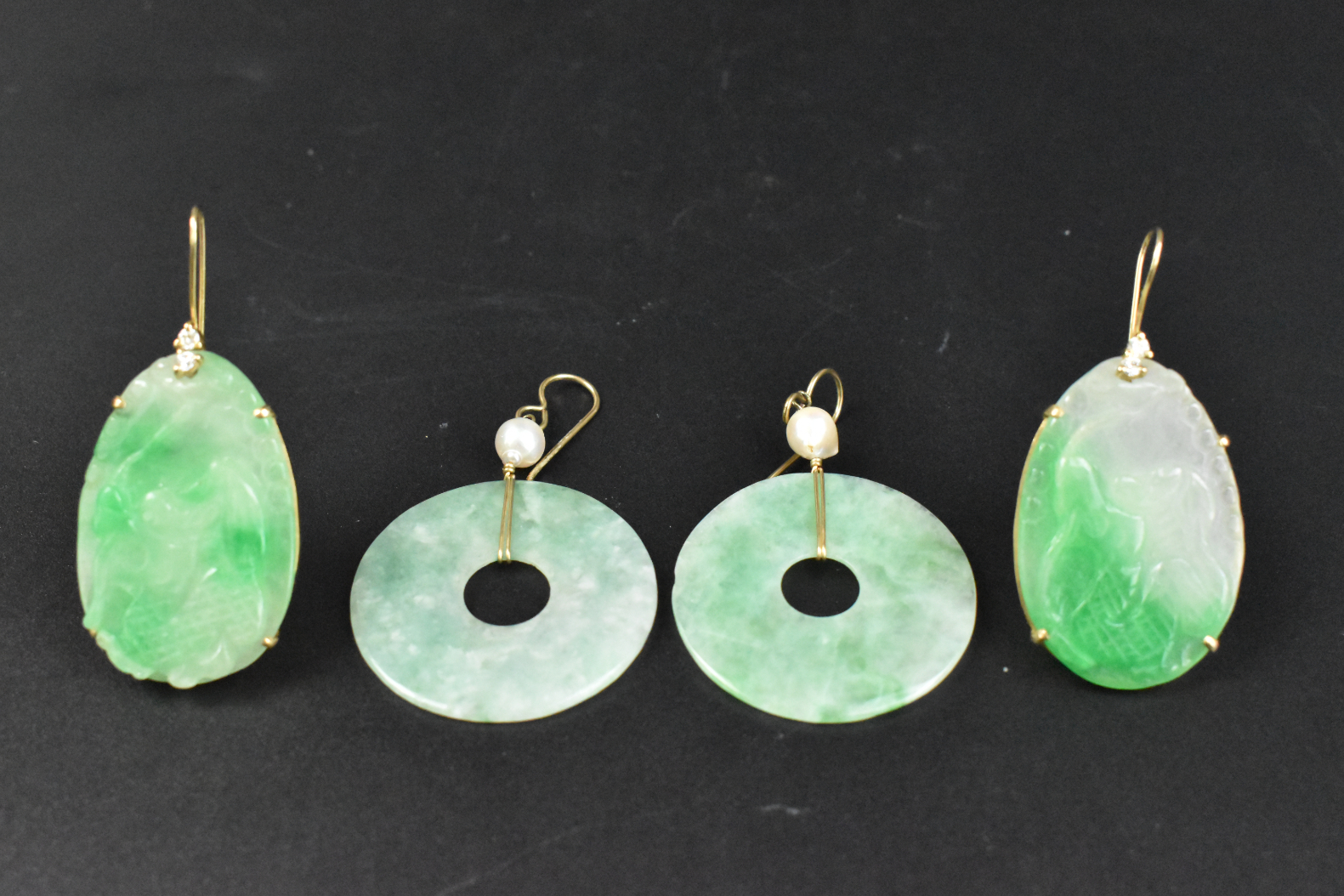 Appraisal: Four Chinese jadeite carved earrings dating from the Qing dynasty