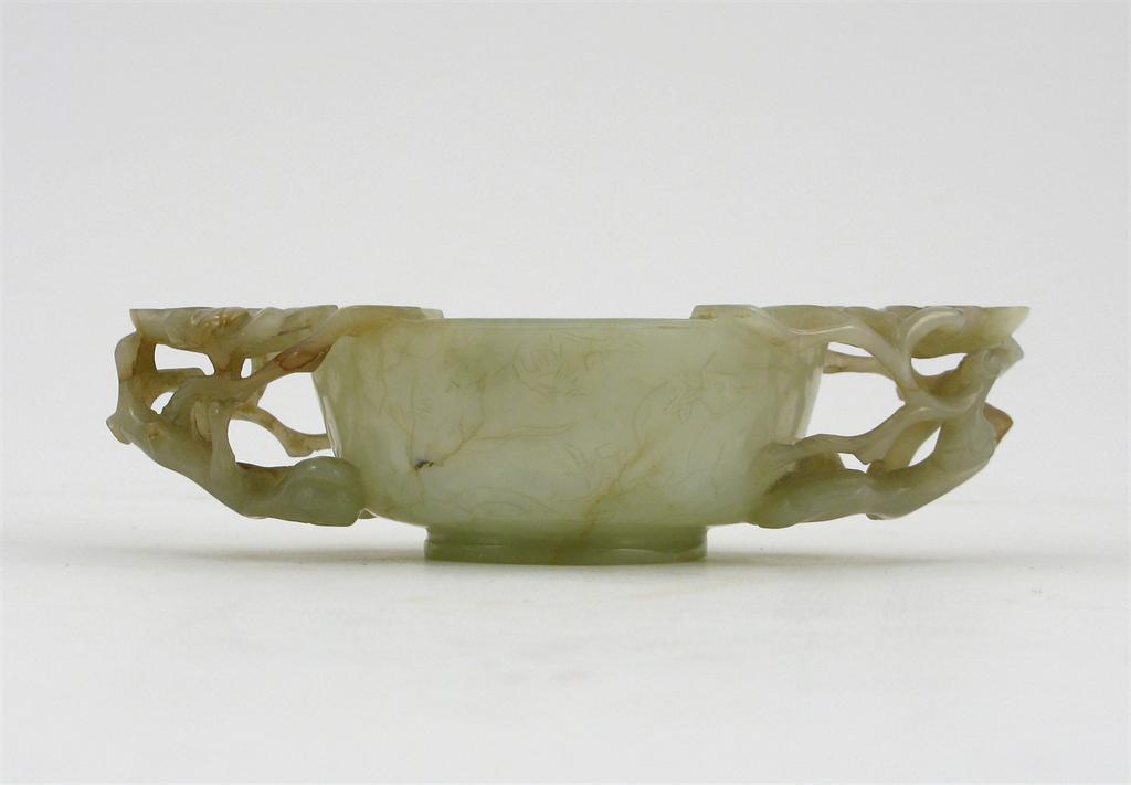 Appraisal: A Chinese celadon jade two handled cup