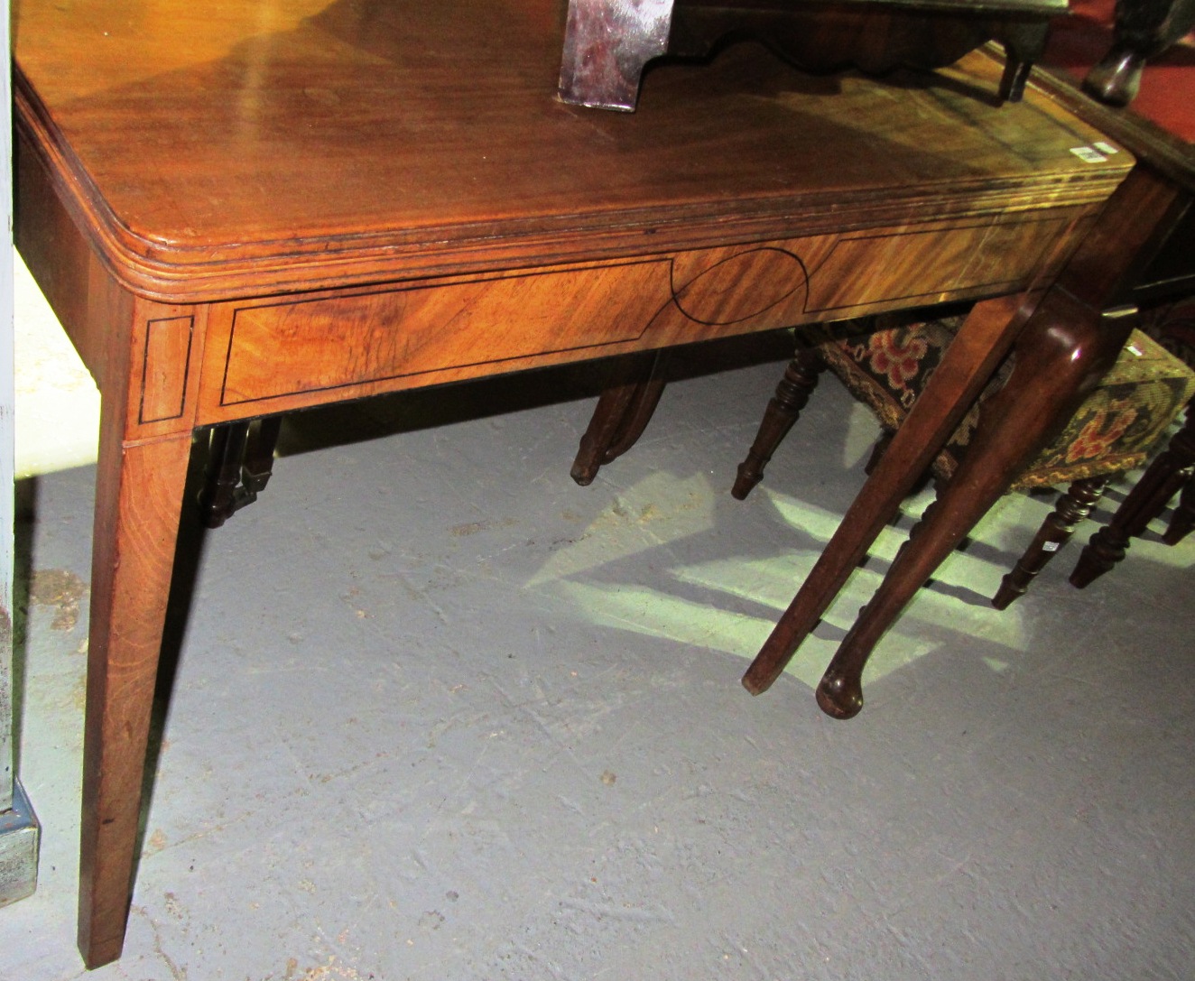 Appraisal: A th century mahogany foldover card table