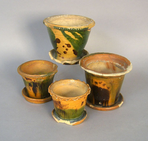 Appraisal: Four Pennsylvania or Virginia redware flower pots th c h