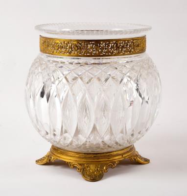 Appraisal: A cut glass vase with pierced gilt metal mounts on