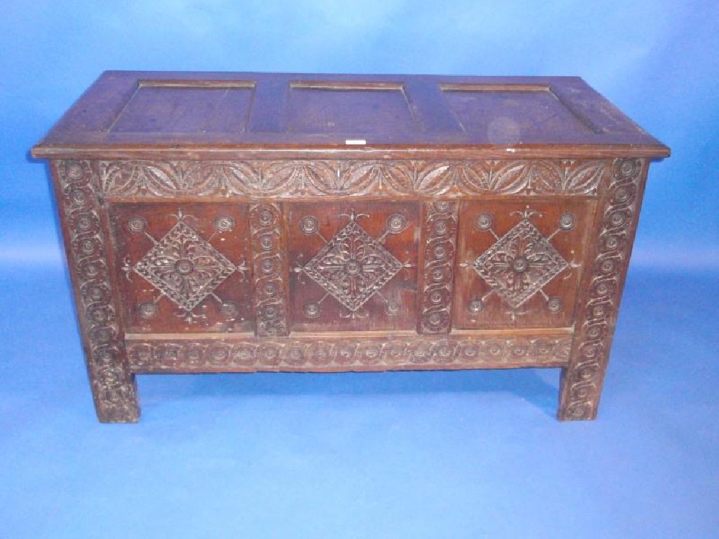 Appraisal: A thC oak coffer with plain three panelled top and