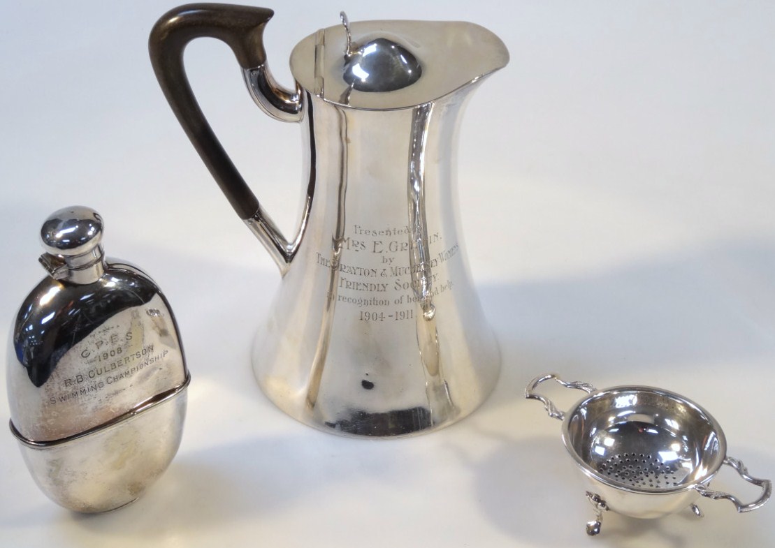 Appraisal: An Elizabeth II silver tea strainer and stand by Barker