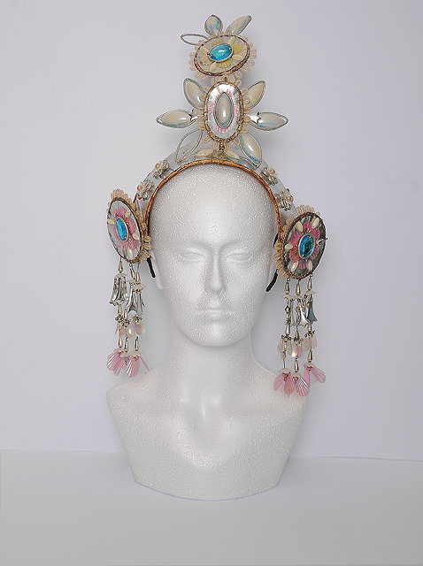 Appraisal: A silver and faux jewel head gear designed by Natalia