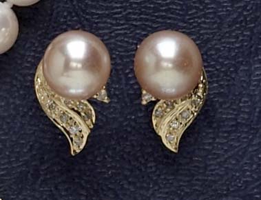 Appraisal: PEARL EARRINGS k yellow gold pierced earrings set with two