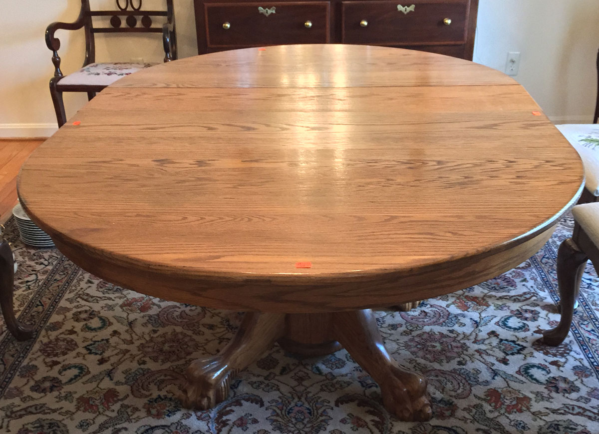 Appraisal: Victorian style oak pedestal dining table with extension leaves