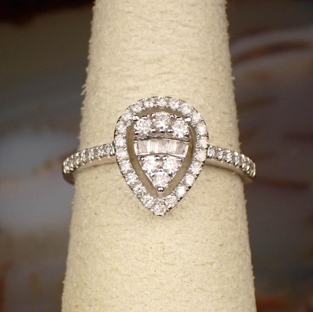 Appraisal: DIAMOND AND EIGHTEEN KARAT WHITE GOLD RING set with round