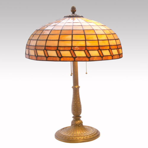 Appraisal: WILLIAMSON Table lamp its geometric caramel slag glass shade over