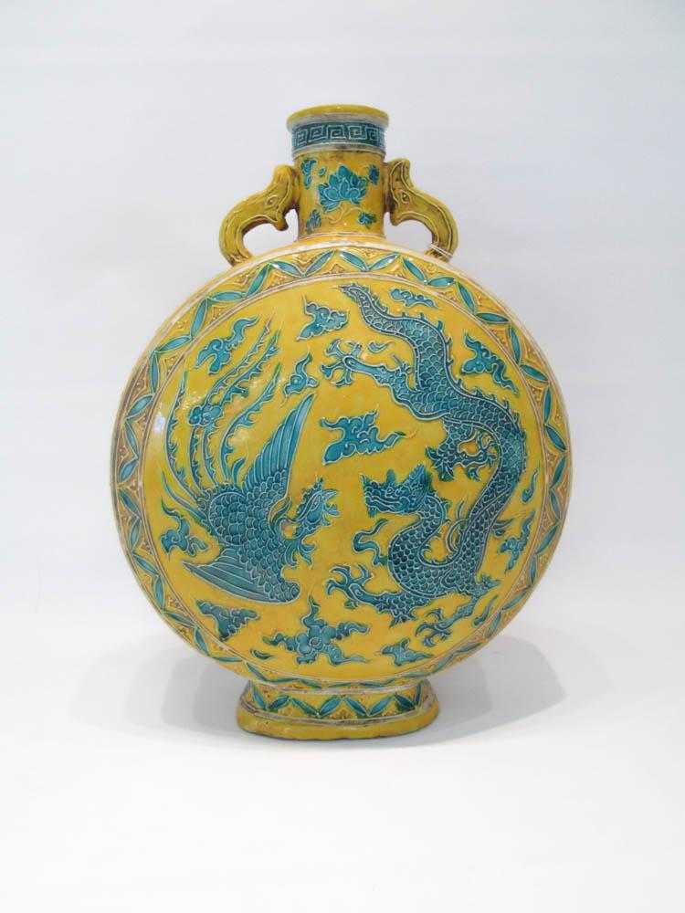 Appraisal: CHINESE PORCELAIN MOON FLASK VASE with split handles relief dragon