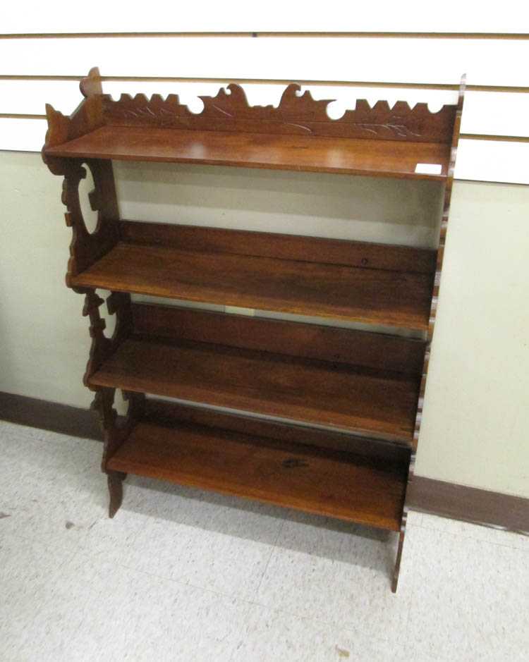 Appraisal: A VICTORIAN WALNUT BOOKSTAND Charles Eastlake design c having four