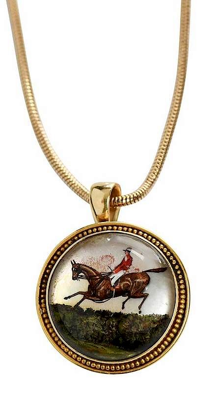 Appraisal: kt Reverse Crystal Pendant rider on horse stamped yellow gold