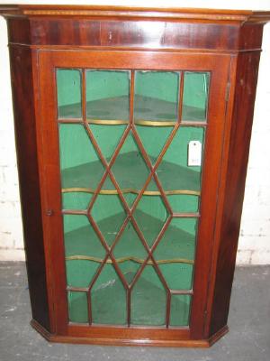 Appraisal: A MAHOGANY BRACKET CORNER DISPLAY CABINET with moulded and inlaid