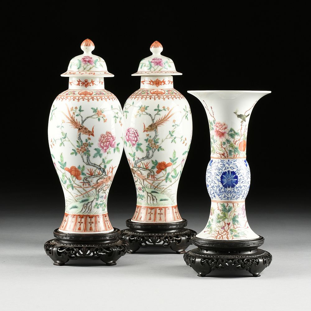 Appraisal: A THREE PIECE CHINESE FAMILLE ROSE LIDDED URNS AND GU