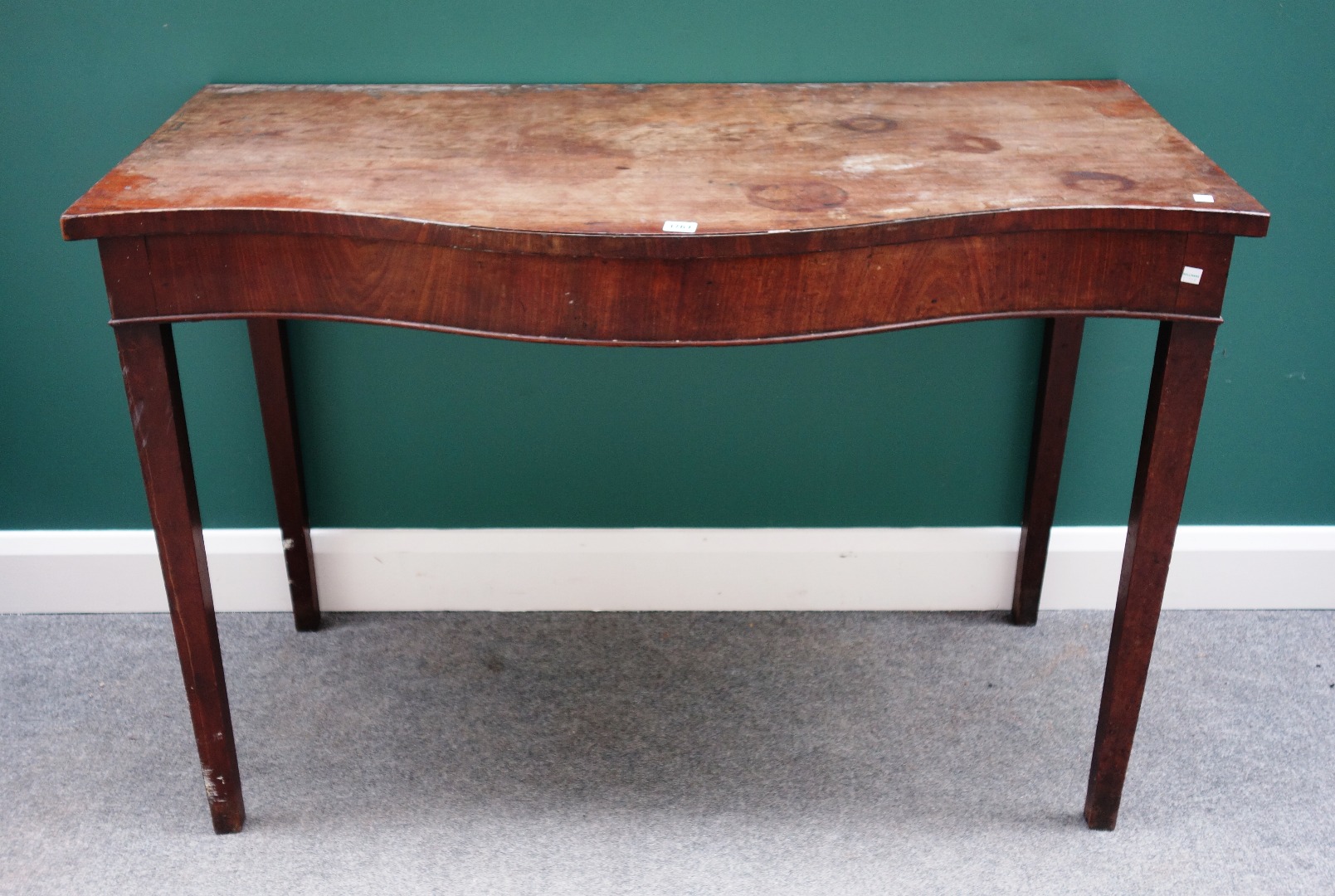 Appraisal: A George III and later mahogany serving table the serpentine