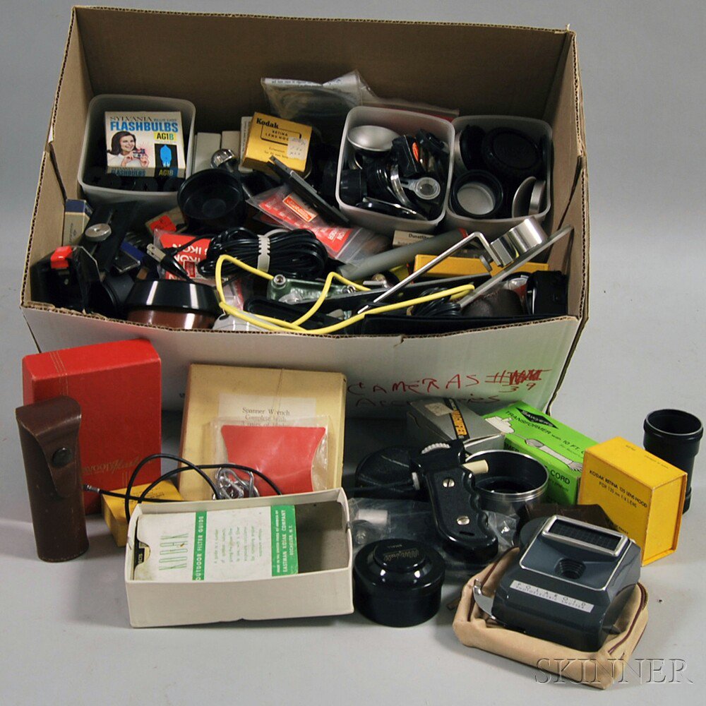 Appraisal: Collection of Miscellaneous Camera Accessories including sync cords lens caps