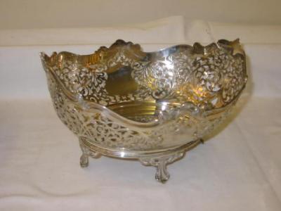 Appraisal: A FRUIT DISH of oval form with shaped scroll moulded