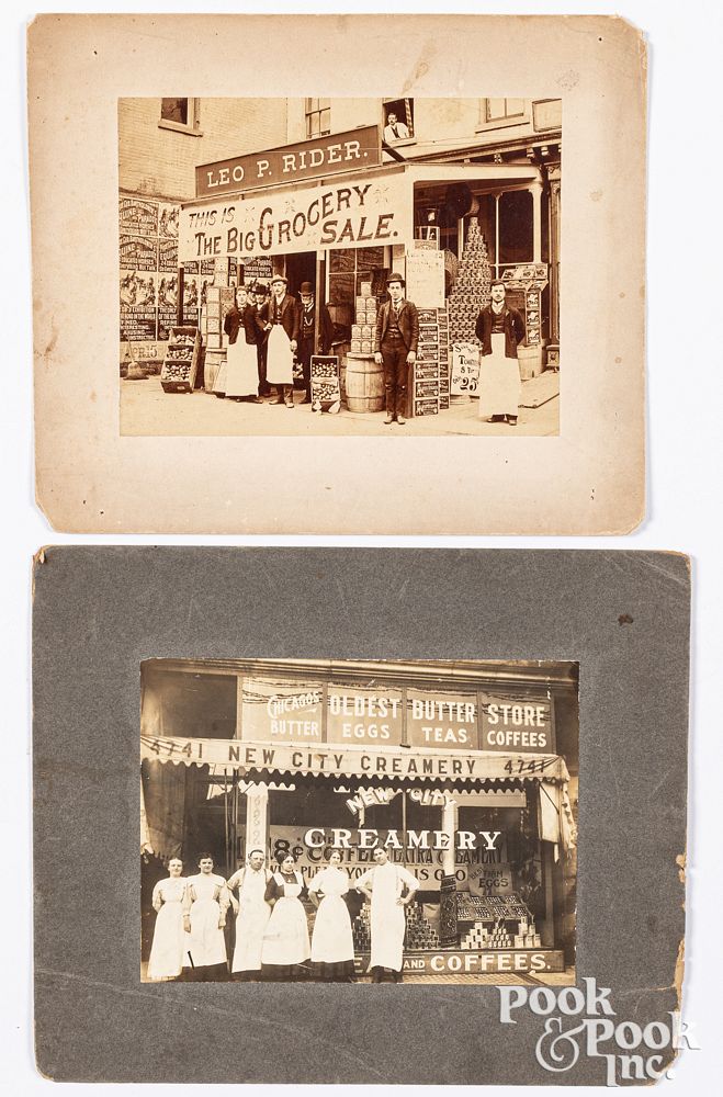 Appraisal: Two storefront photos featuring extensive signage Two storefront photographs featuring