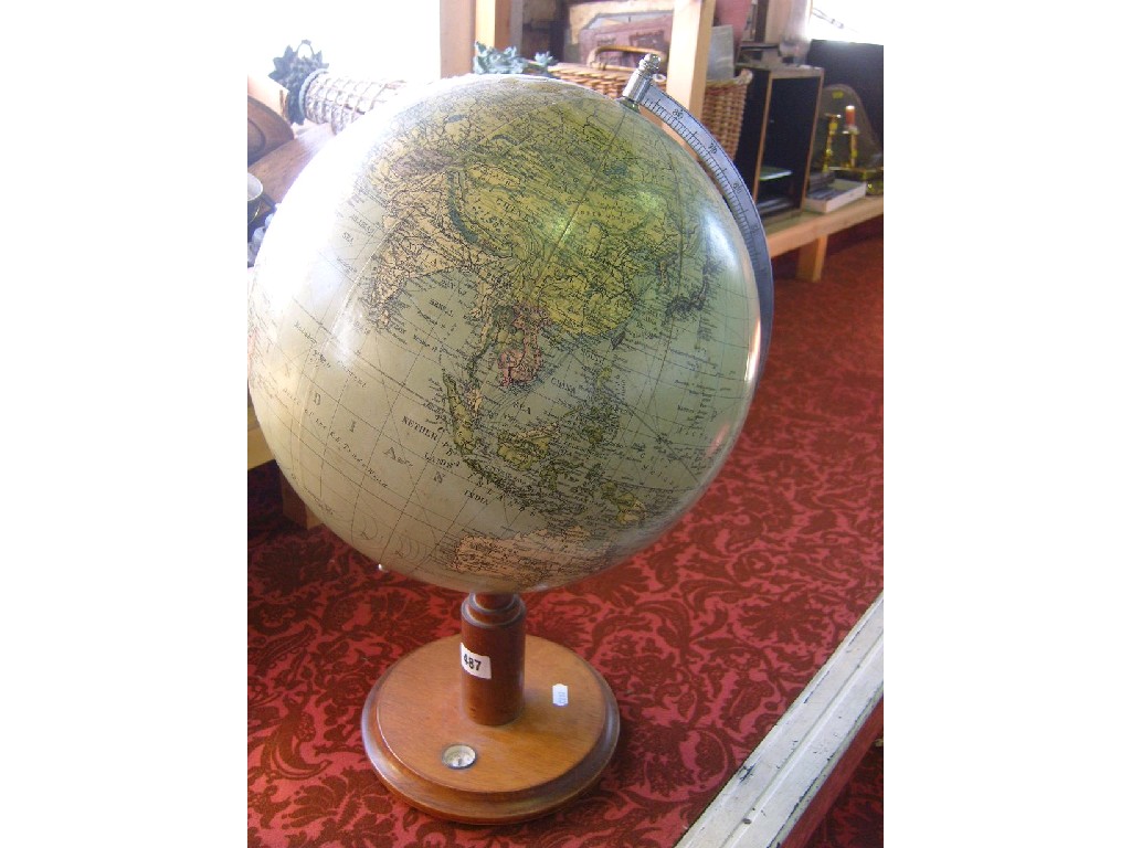 Appraisal: A terrestrial globe raised on circular wooden stand with inset