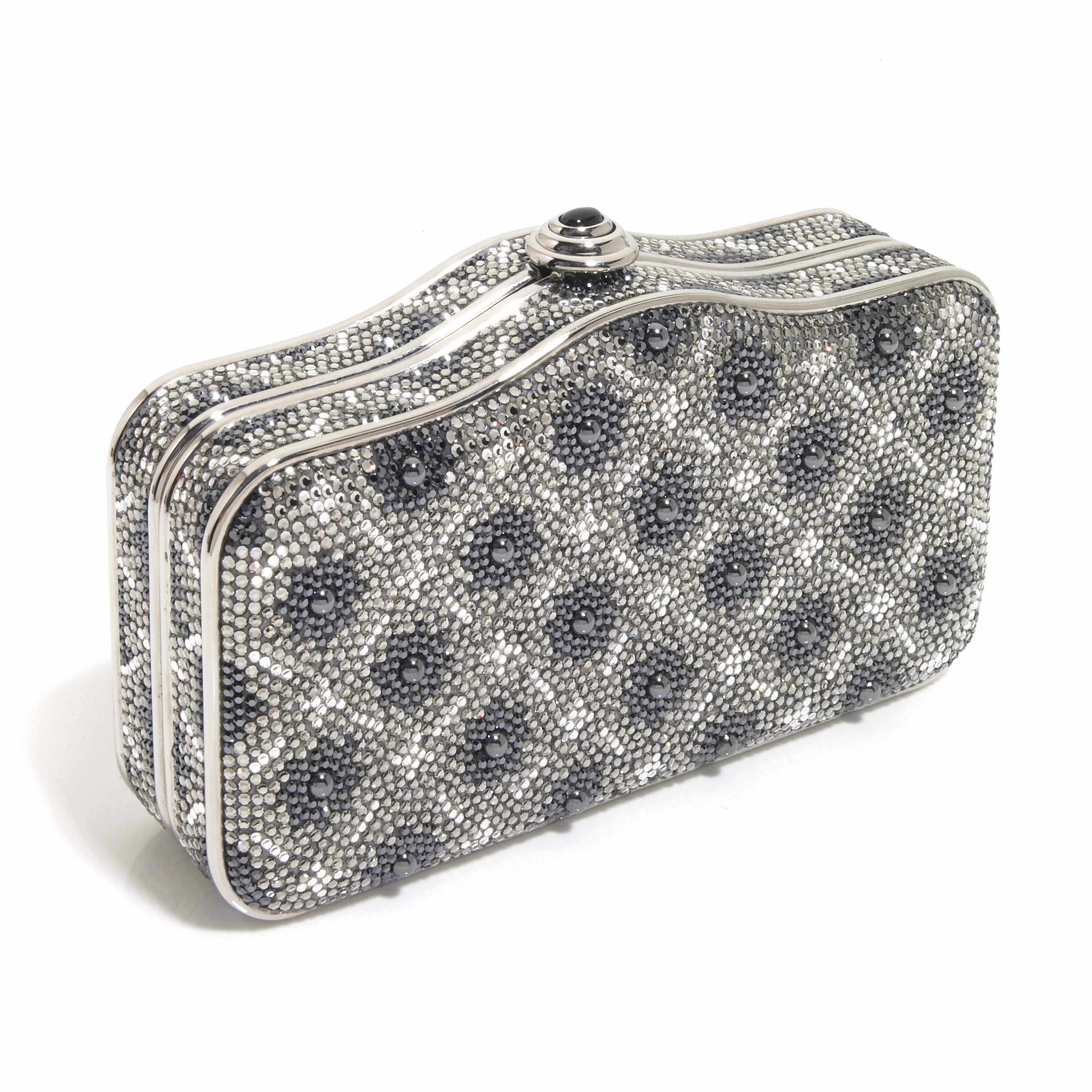 Appraisal: A rectangular scalloped purse with dark blue pewter and silver