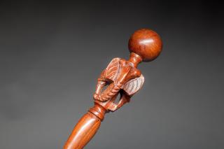 Appraisal: Elephant Cane A lathe-turned tropical wood shaft with carved elephants