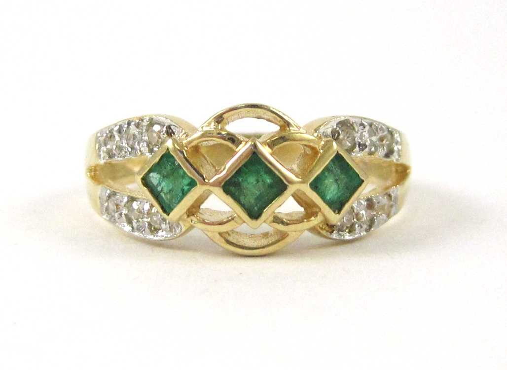 Appraisal: EMERALD DIAMOND AND FOURTEEN KARAT GOLD RING set with three