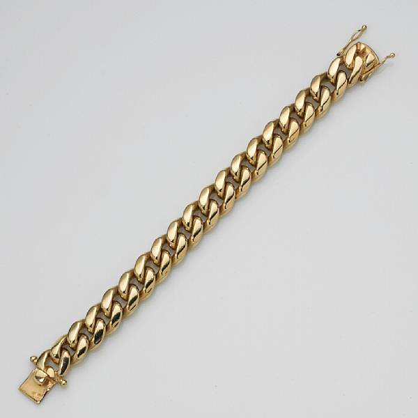 Appraisal: A fourteen karat gold curb link bracelet weighing approximately grams