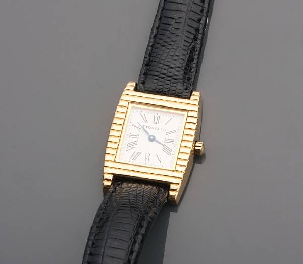 Appraisal: An k gold wristwatch with leather strap dial signed Tiffany