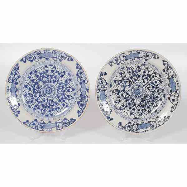 Appraisal: Pair of Delft Chargers Holland Floral and geometric design in