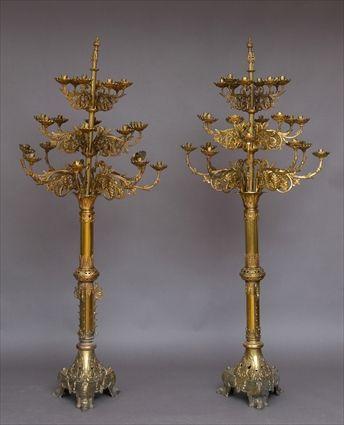 Appraisal: PAIR OF FRENCH GOTHIC-STYLE BRASS AND GILT BRONZE FOURTEEN-LIGHT TORCHERES