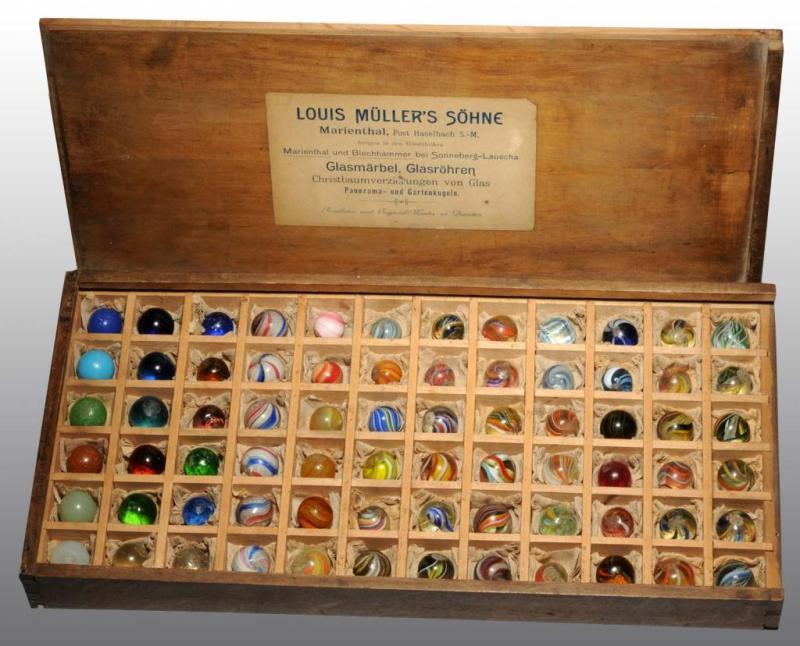 Appraisal: Original Wooden Box of Muller Son Marbles Description Possibly a