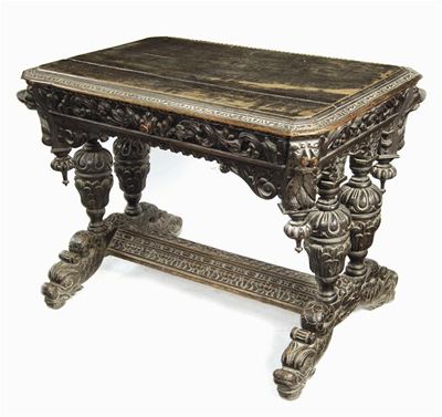 Appraisal: A continental carved oak centre table in th century style