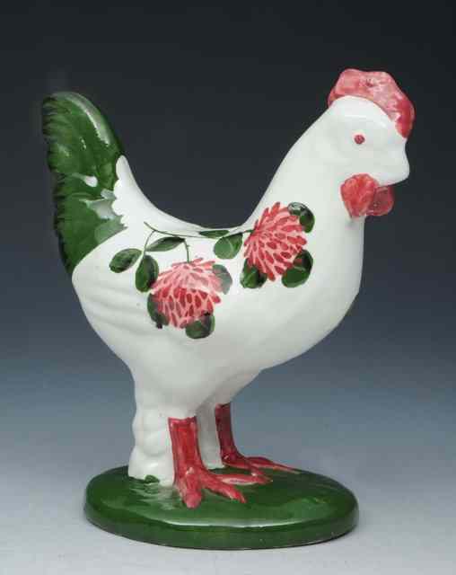 Appraisal: A PLICHTA POTTERY MODEL of a cockerel on a green