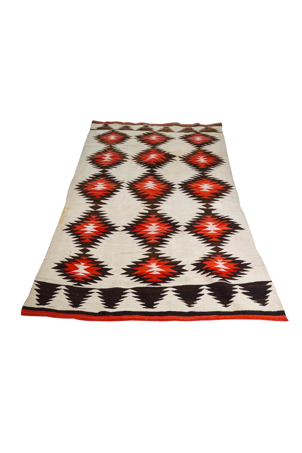 Appraisal: NAVAJO BROWN RED CREAM WOOL RUGProvenance The Estate of Barron