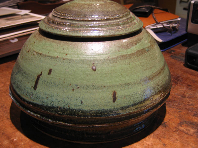 Appraisal: GREEN GLAZED STUDIO POTTERY VESSEL of flattened round form with