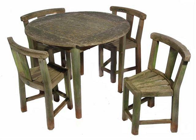 Appraisal: A TEAK CIRCULAR GARDEN TABLE with slatted top and a