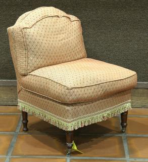 Appraisal: Moderne slipper chair having an orange upholstered seat and back