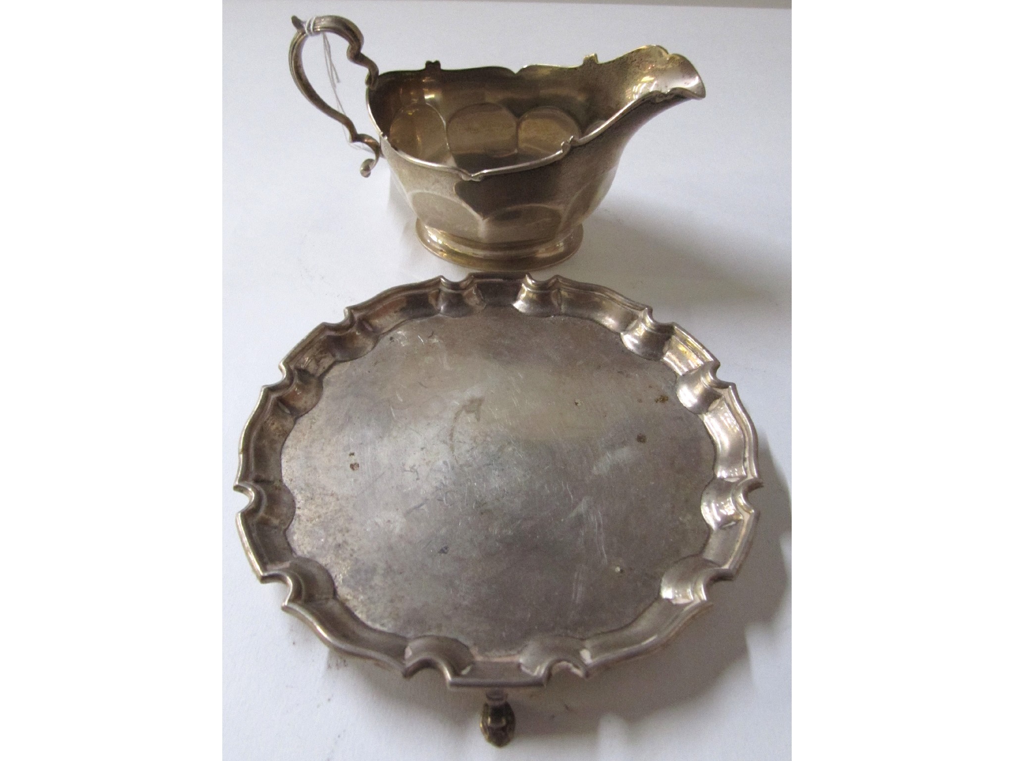 Appraisal: A lot comprising a silver sauceboat Birmingham and a silver