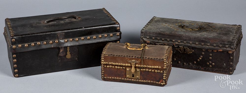 Appraisal: Three leather covered boxes th c Three leather covered boxes