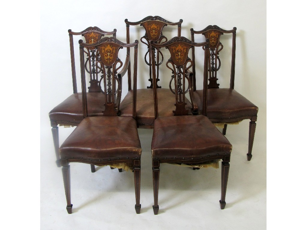 Appraisal: An Edwardian mahogany inlaid parlour armchair decorated with carved and