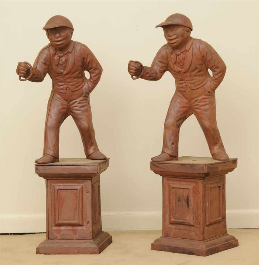 Appraisal: PAIR OF RED-PAINTED CAST-IRON JOCKEY HITCHING POSTS Each capped figure