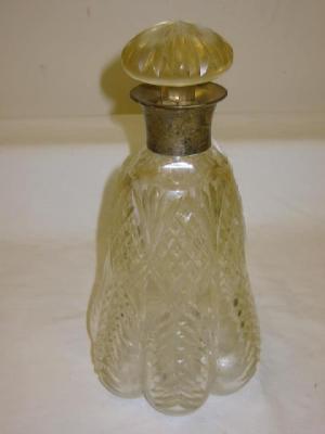 Appraisal: A CUT GLASS DECANTER of lobed tapering form with mushroom