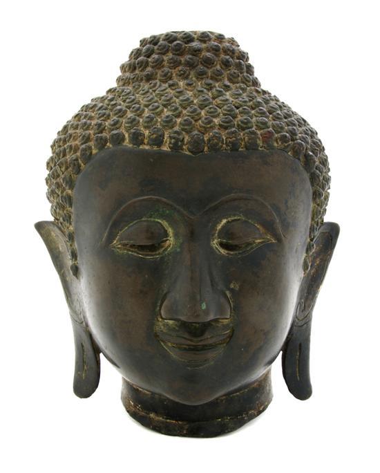 Appraisal: Bronze Model of the Head of Buddha of heavily cast